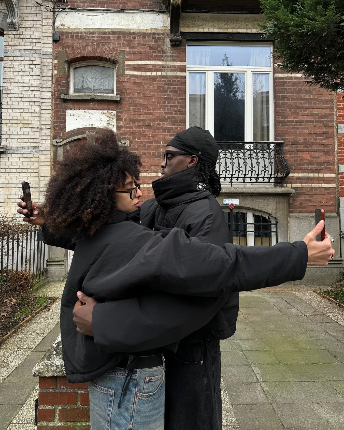 Street portrait of two figures