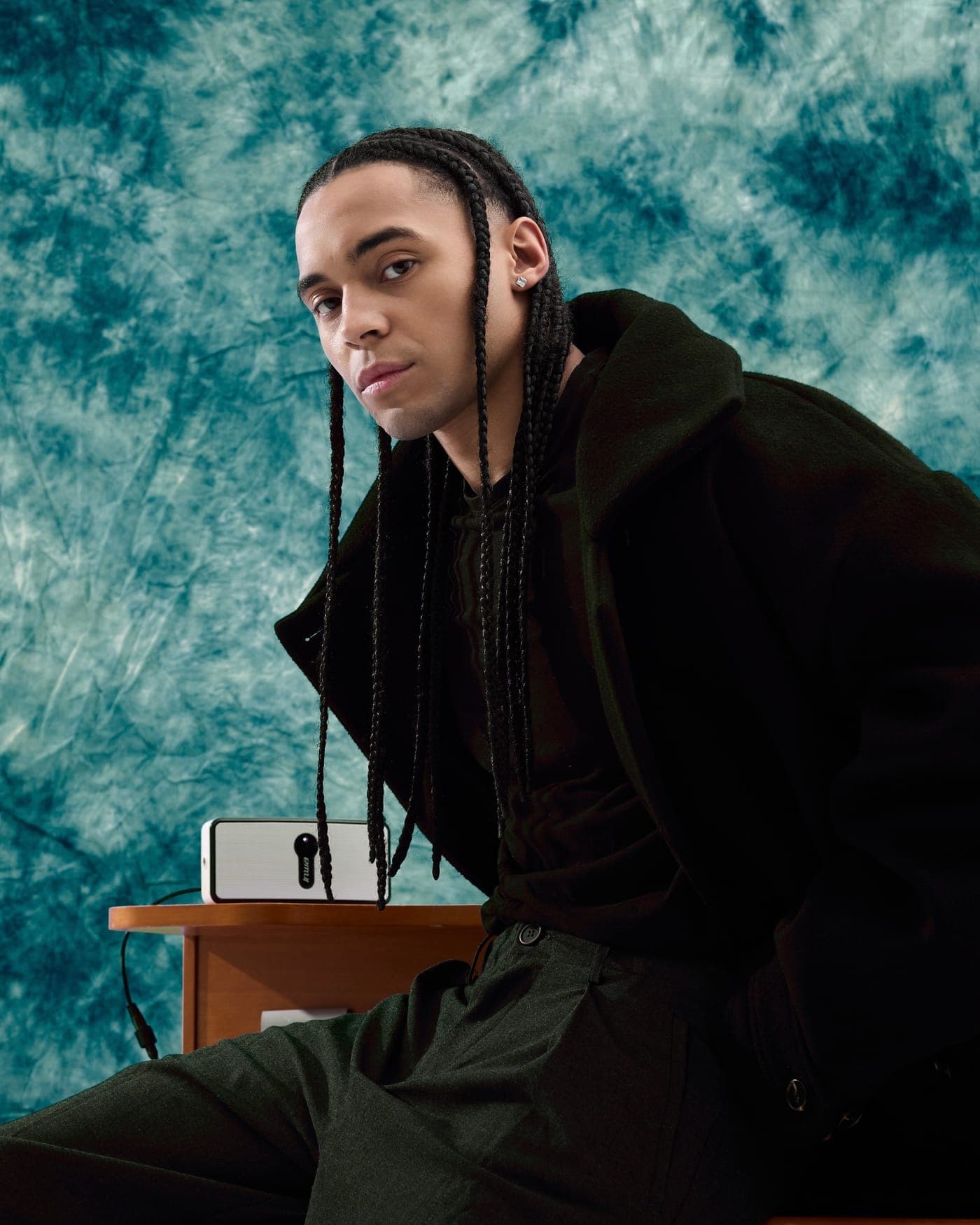 Studio portrait against a hand-painted backdrop