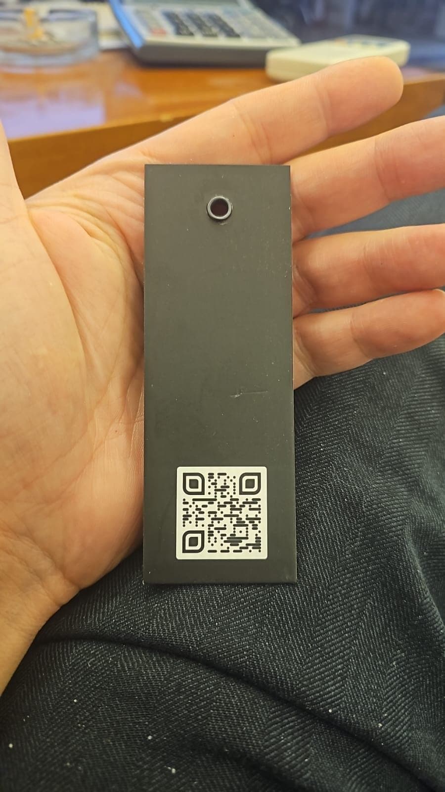 Reverse of the hangtag, carrying a scannable code