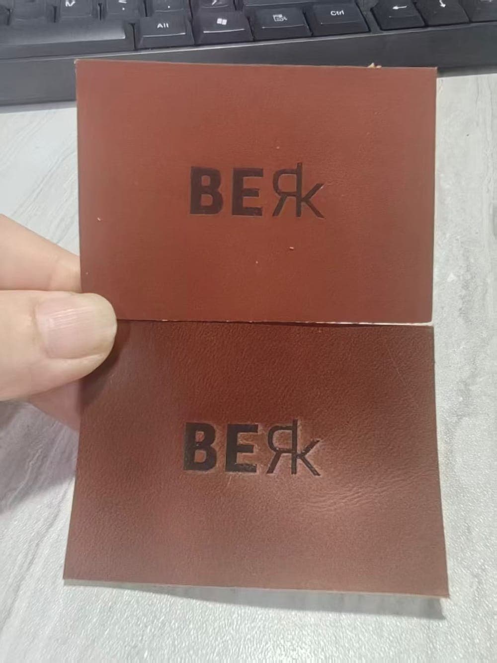 Debossed leather patch, two finishes tested side by side