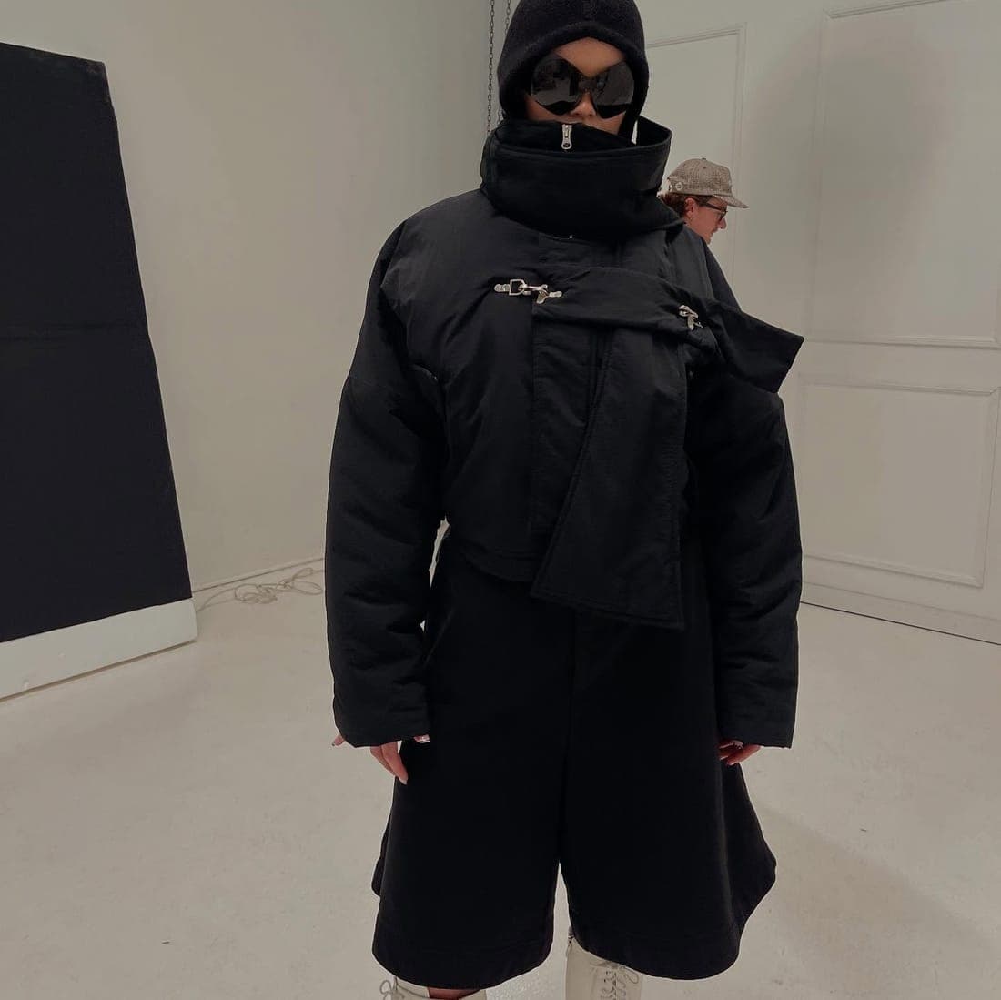 Wearer in the cropped puffer and shorts